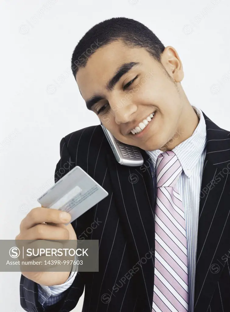 Businessman with mobile and credit card