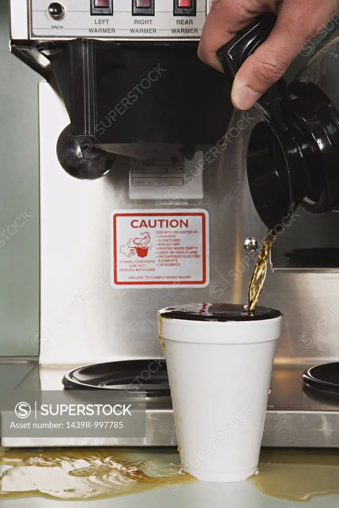 Businessman pouring a coffee
