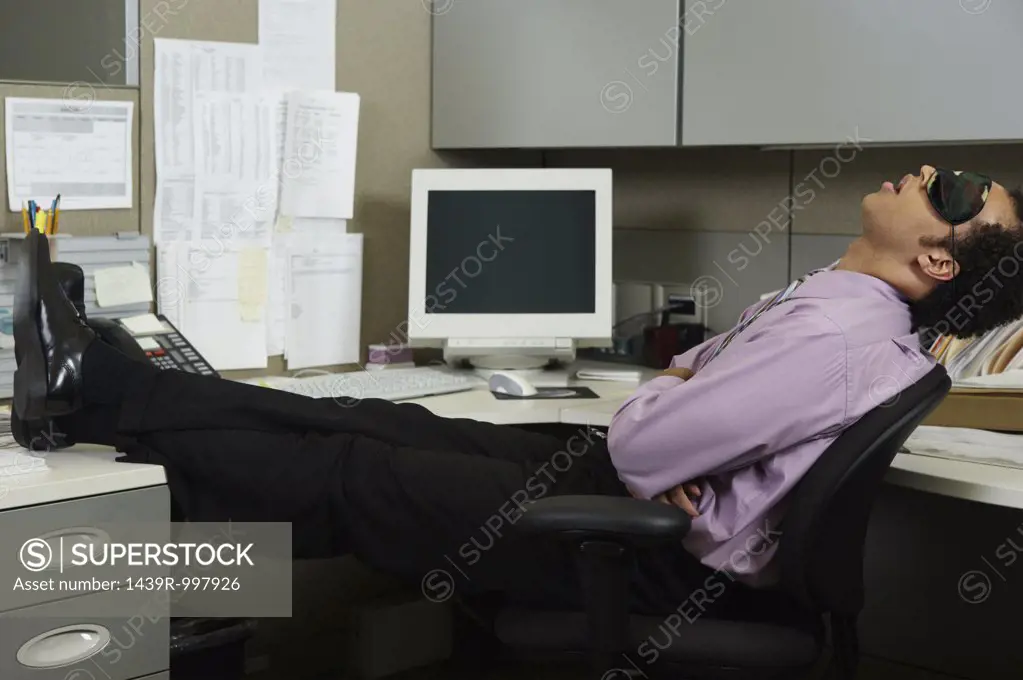Businessman sleeping at his desk