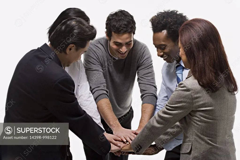 five office workers showing unity