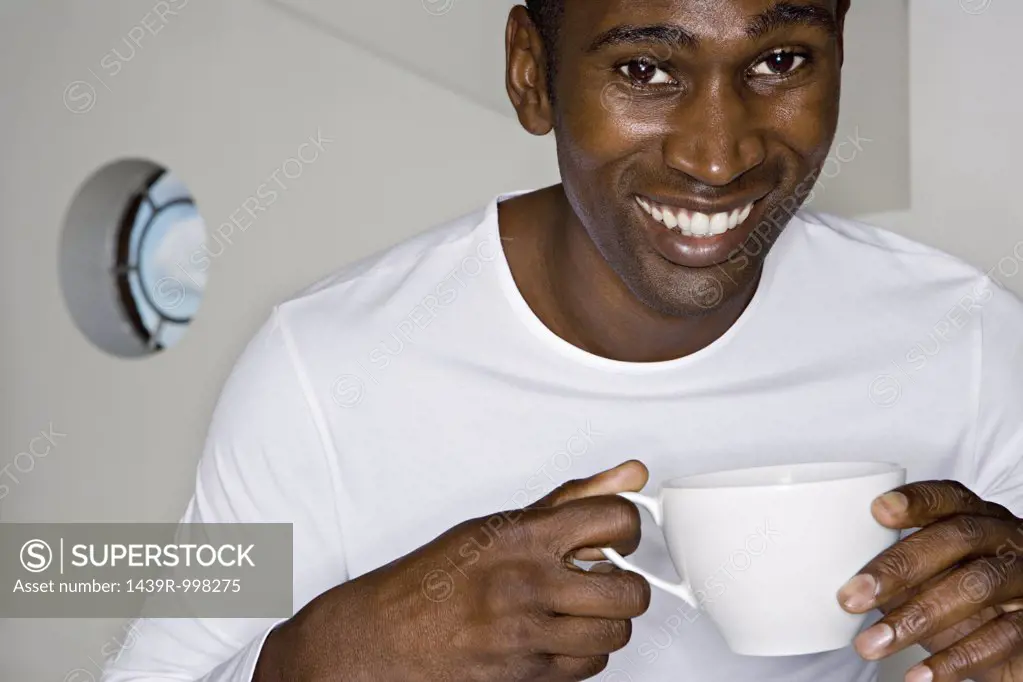 Happy man with teacup