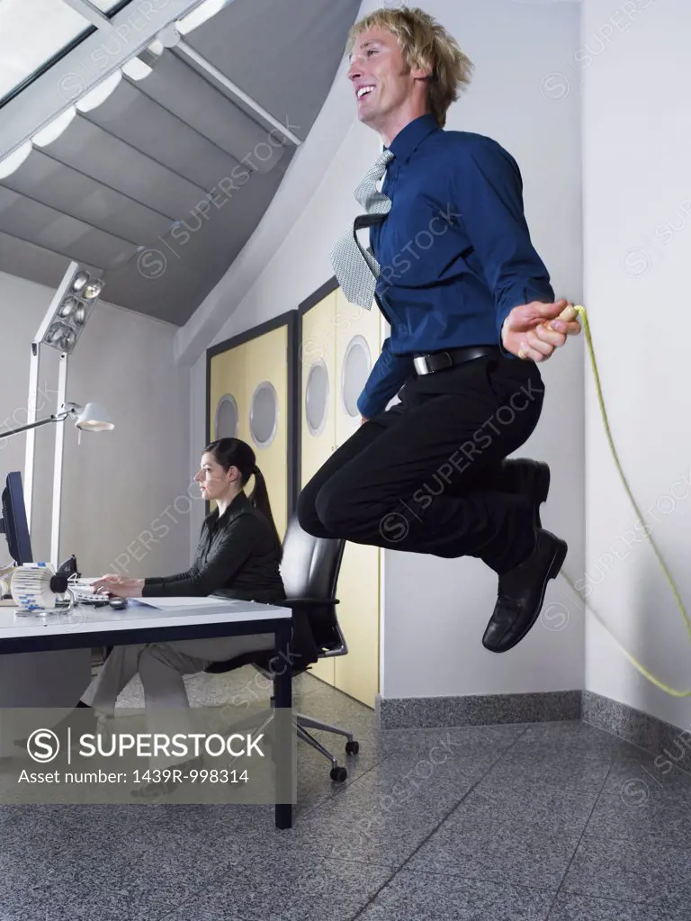 Man skipping in office