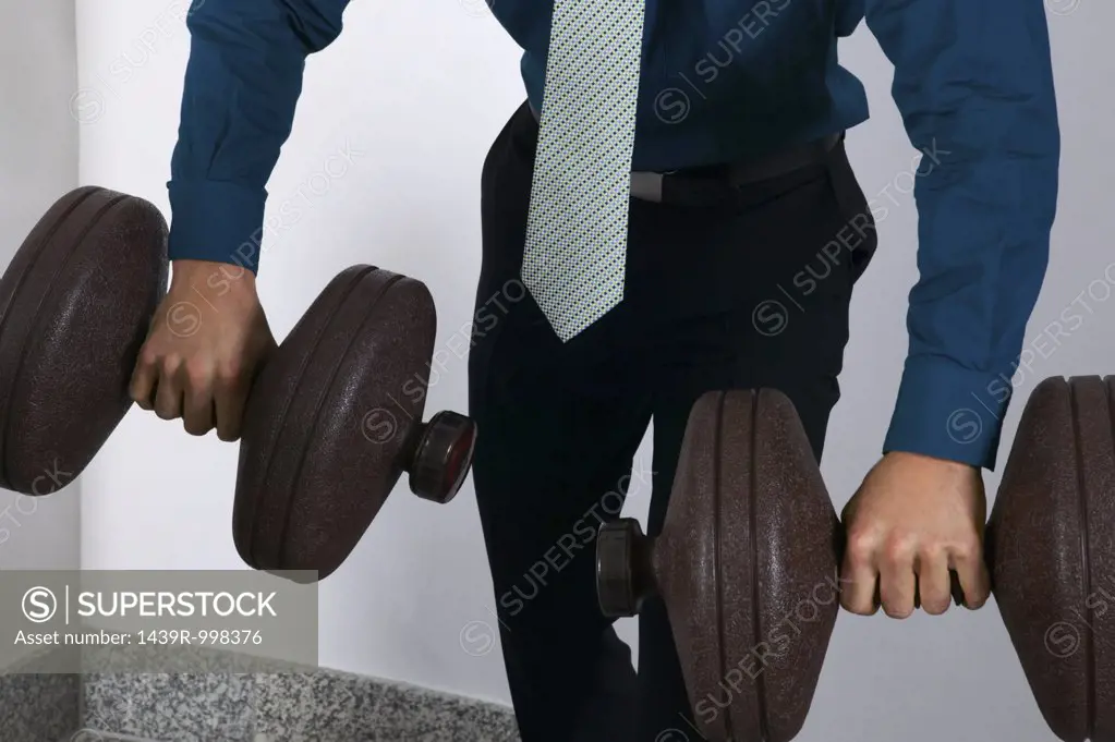 Office worker weightlifting