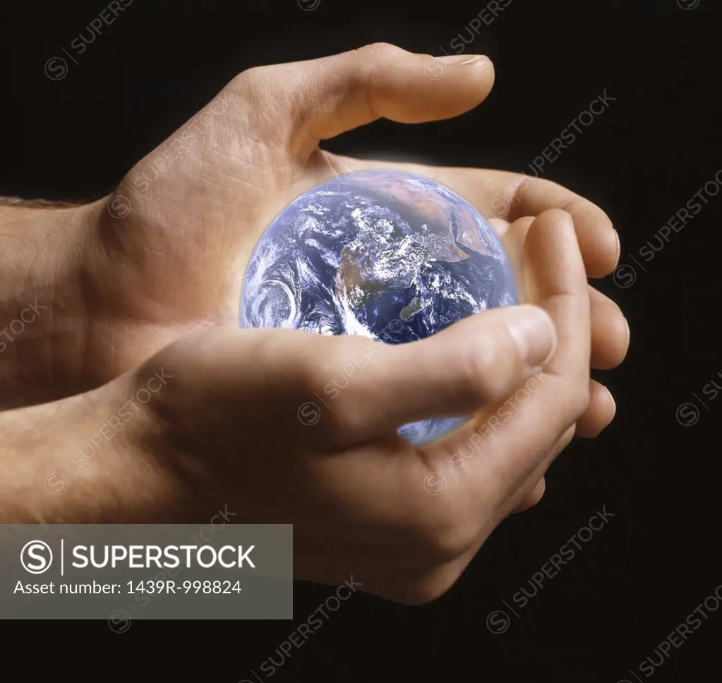 Person holding planet earth