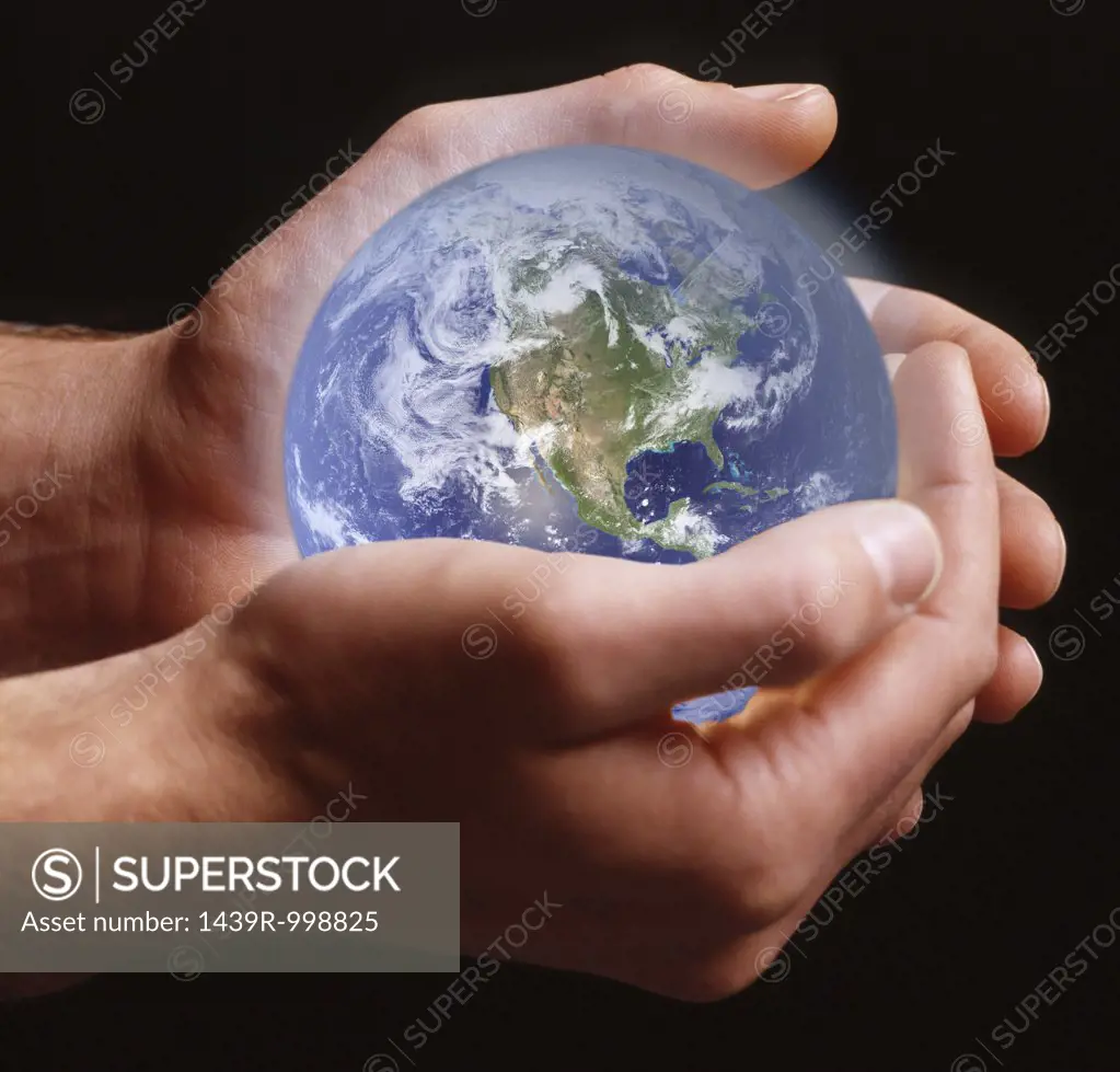 Person holding planet earth