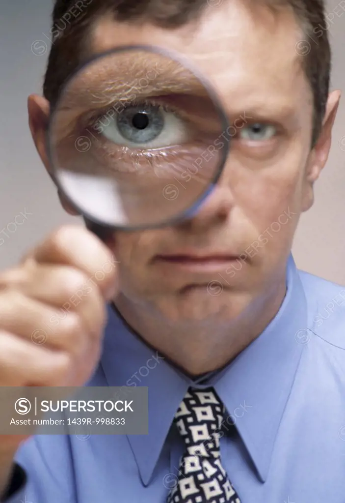 Man holding a magnifying glass