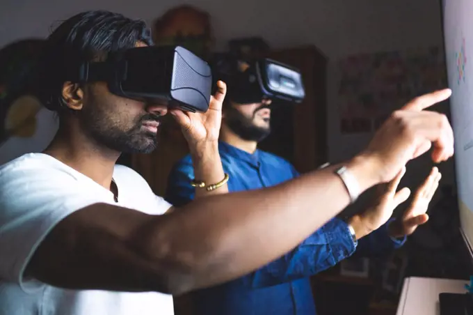 Men using virtual reality headsets
