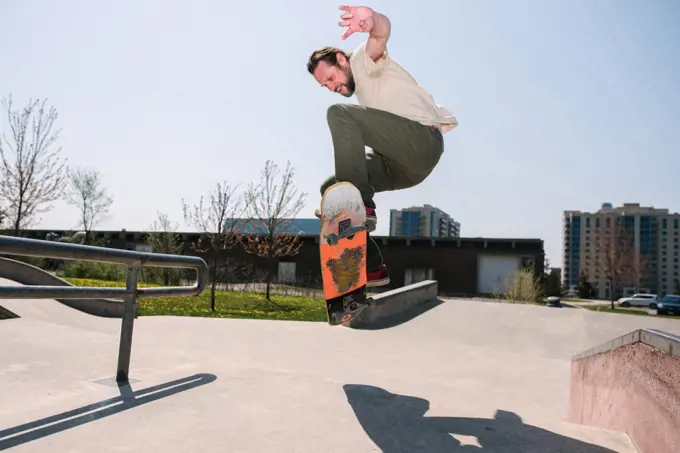 Canada, Ontario, Kingston, Man skateboarding in skate park
