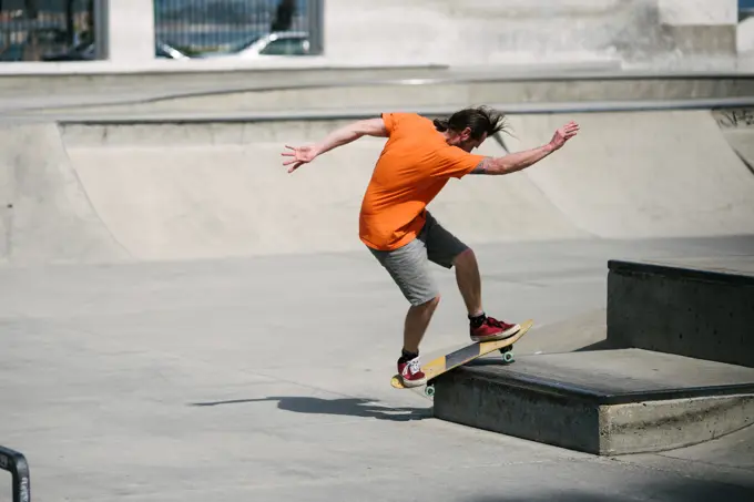USA, California, Ventura, Man skateboarding in skate park