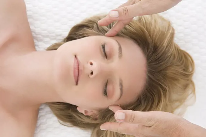 A woman having a head massage