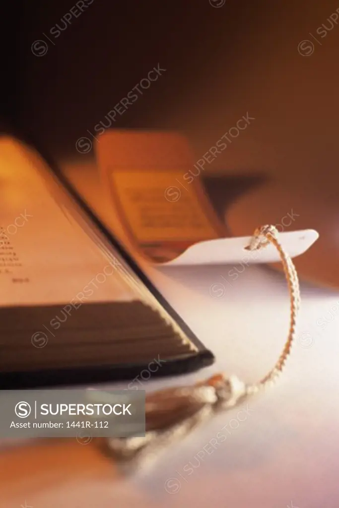 Close-up of a bookmark near a book