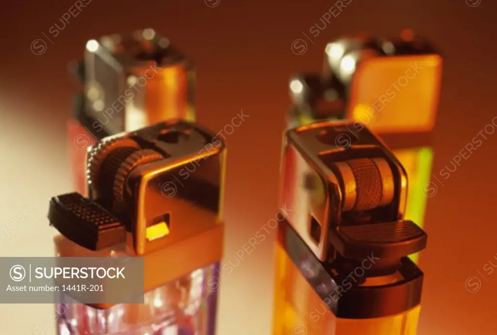 Close-up of four disposable lighters