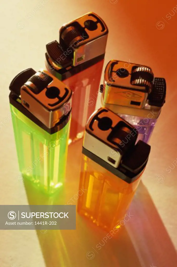 Close-up of four disposable lighters