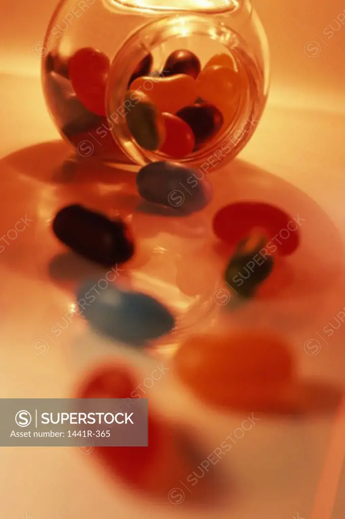 Close-up of jellybeans spilling from a jar