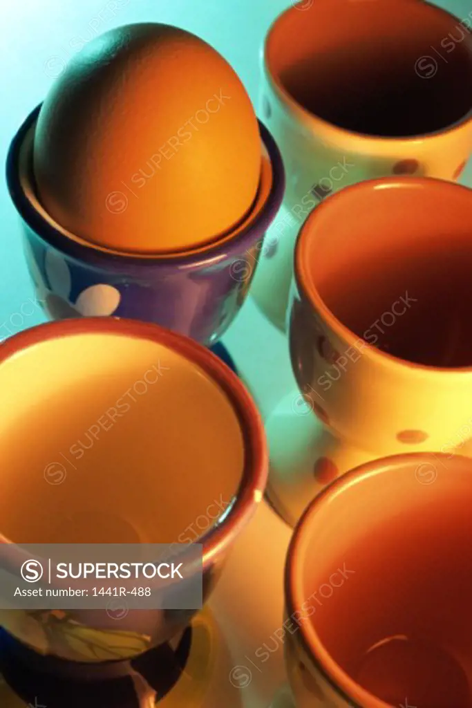 High angle view of hard-boiled eggs in eggcups