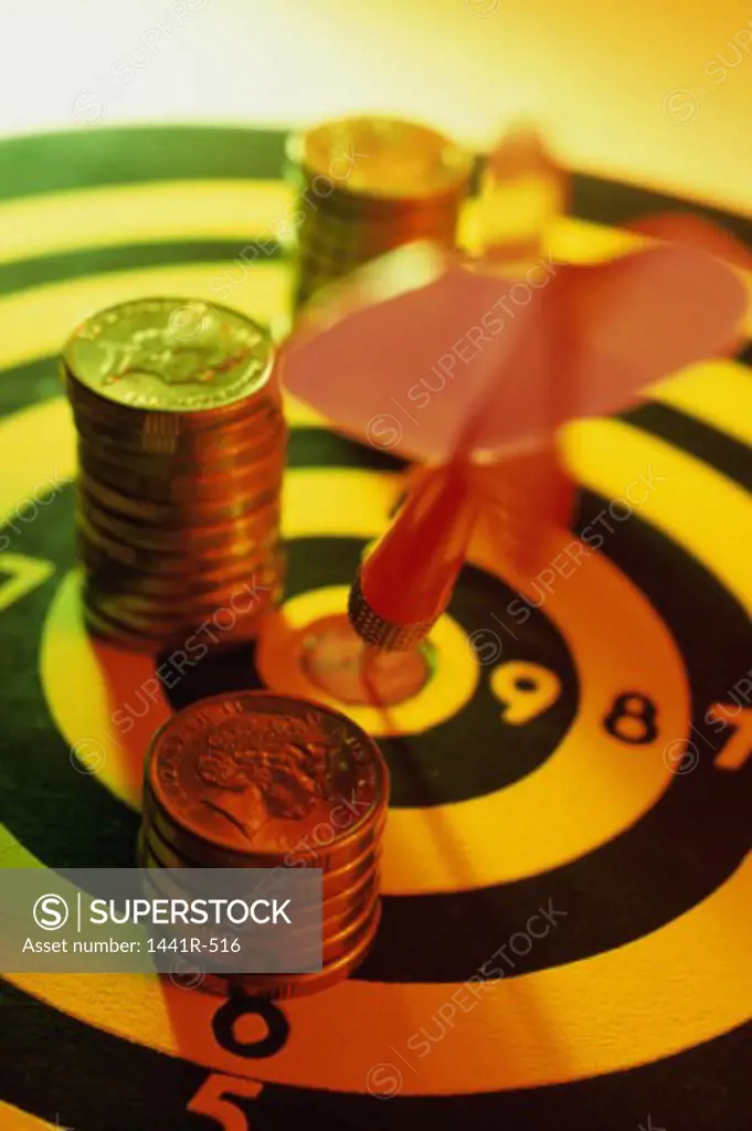 Stack of coins on a dartboard