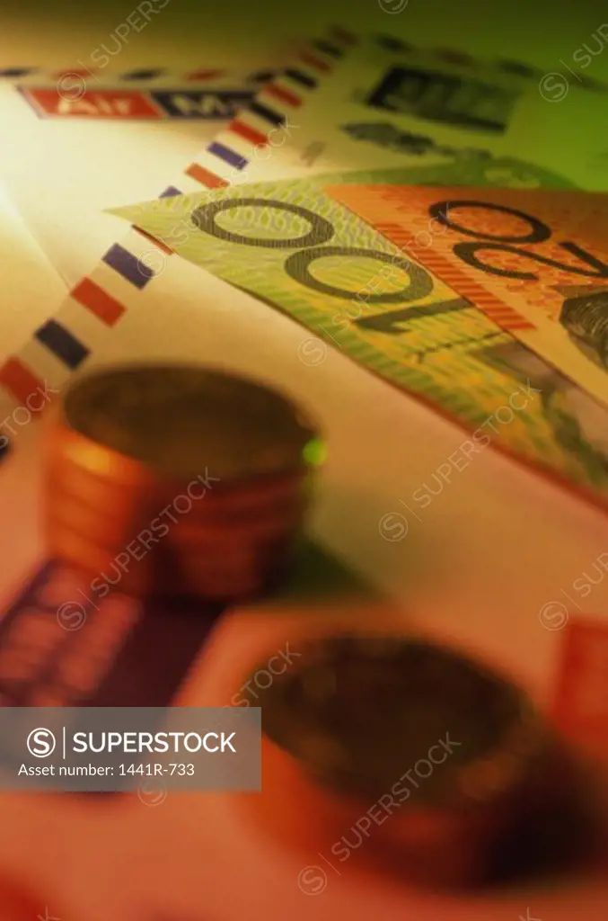 Paper currency and coins on an envelope
