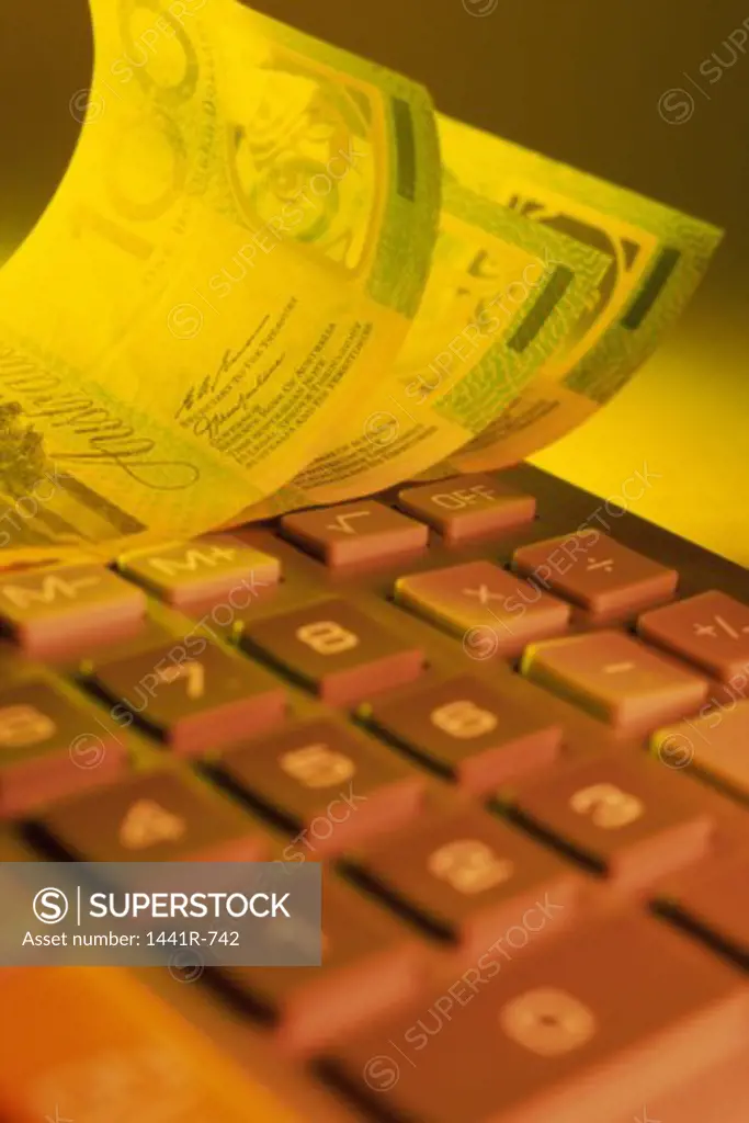 Australian banknotes near a calculator