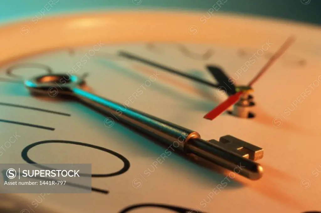 Close-up of a key on a clock