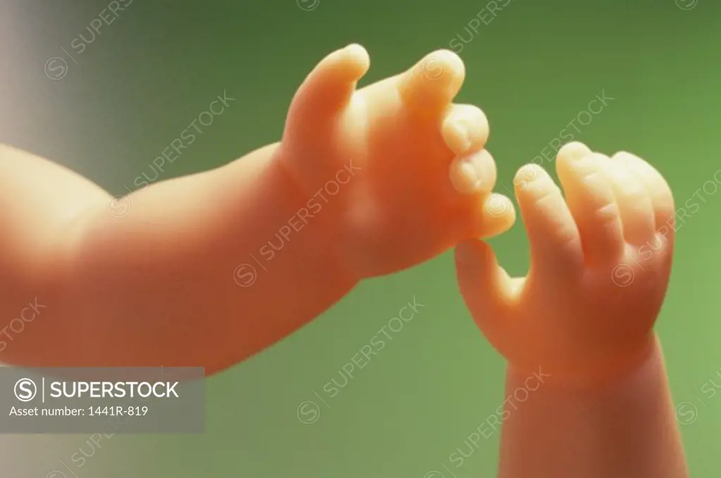 Close-up of the hands of a doll
