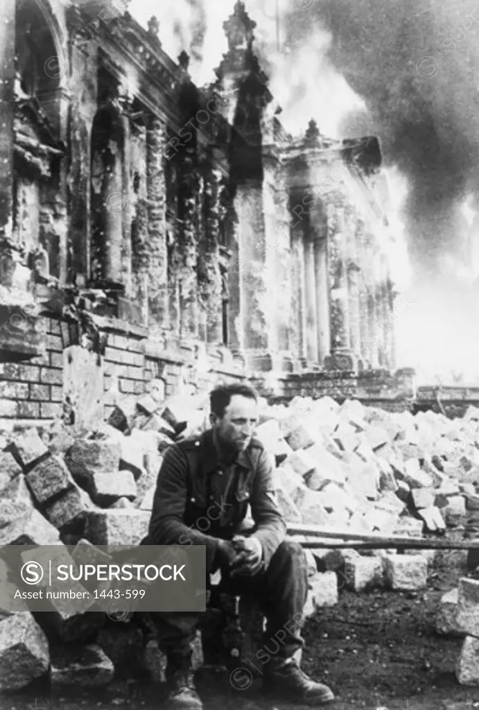 German soldier sitting on rubble, Reichstag, Berlin, Germany, 1945