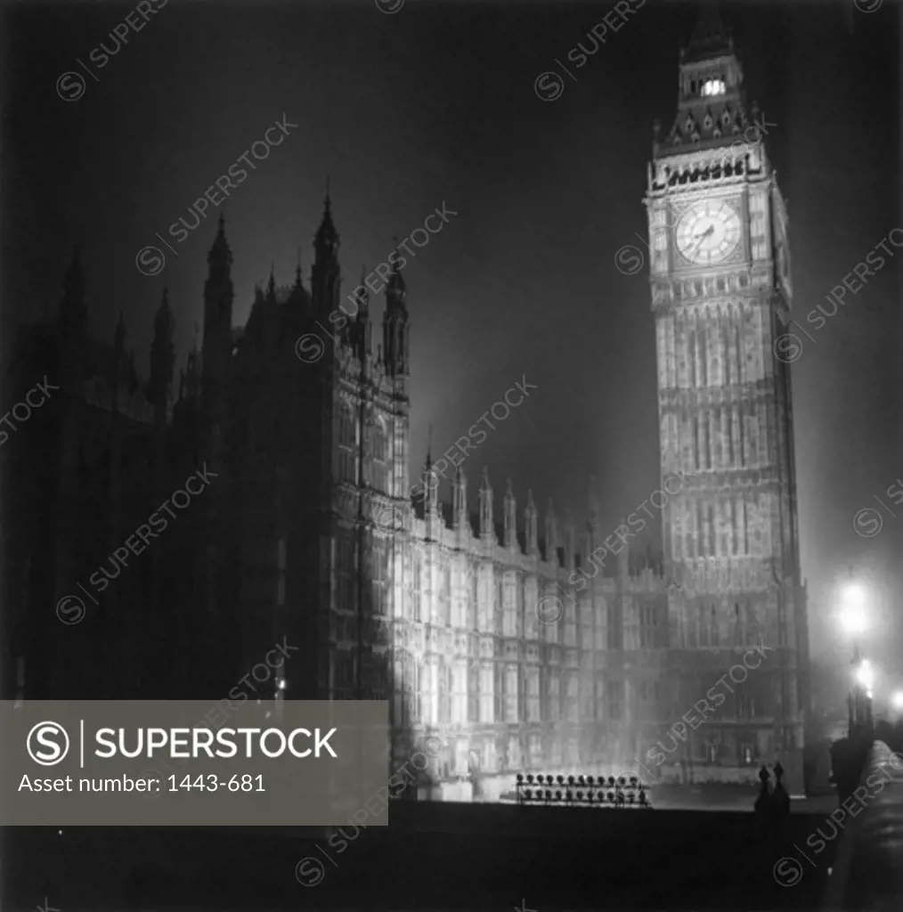 Low angle view of a clock tower lit up at night, Big Ben, Houses of Parliament, London, England