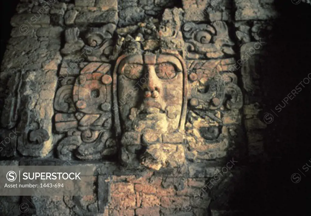 Close-up of a human face carved on a wall, Temple of the Masks, Kohunlich, Quintana Roo, Mexico