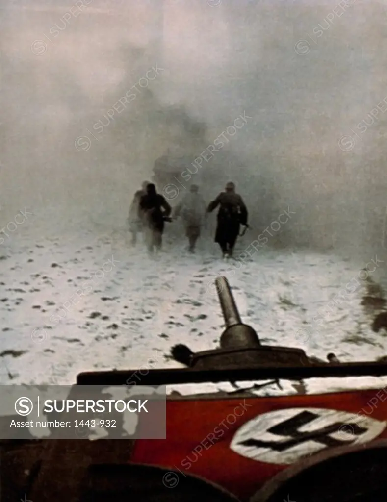 Rear view of German soldiers walking on snow, c. 1942