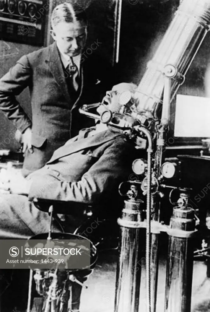 Dentist examining a patient, Paris, France, 1920