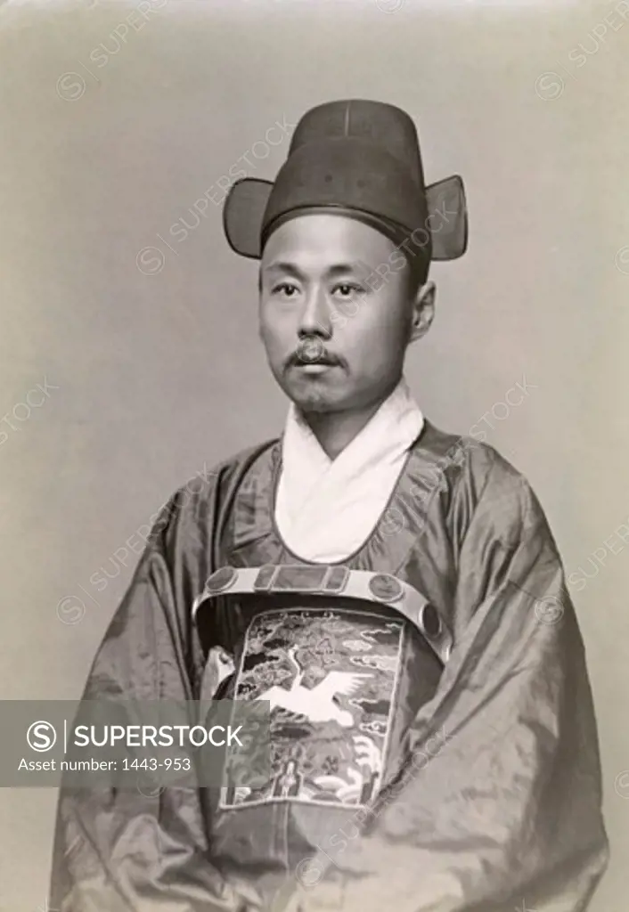 Close-up of a young man in traditional clothing, c. 1890