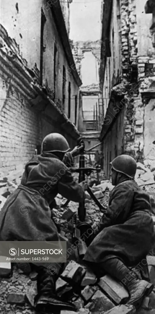 Two Red Army soldiers loading a grenade into a grenade launcher, Battle of Stalingrad, Stalingrad, Russia, 1942