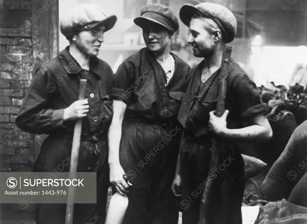 Three female workers talking to each other, Russia, 1930