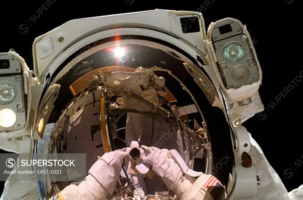 Astronaut taking a self-portrait in space during extravehicular activity at the international space station, September 12, 2006