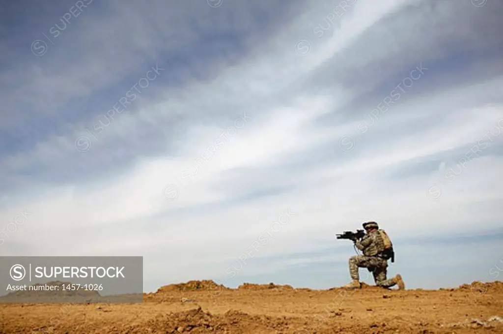 U.S. Army Sergeant provides security during a patrol of the Riyahd village in Iraq