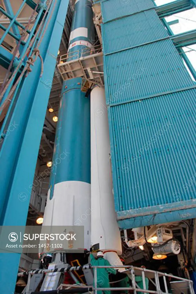 On Space Launch Complex 2 at Vandenberg Air Force Base in California, the second solid rocket motor, or SRM, is moved into place alongside the Delta II first stage. The Delta II is the launch vehicle for the OSTM/Jason-2 spacecraft, USA