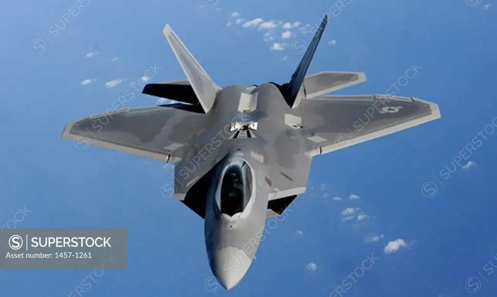 An F-22 Raptor moves into position to receive fuel from a KC-135 Stratotanker, Pacific Ocean