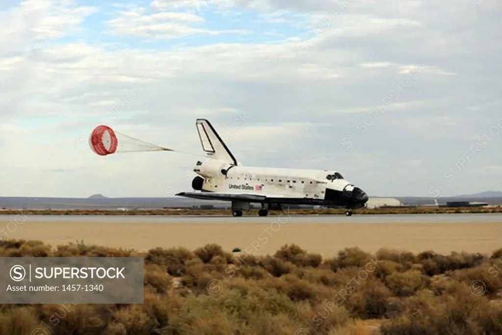 With its drag chute deployed, Space Shuttle Discovery slows to a stop, NASA's Dryden Flight Research Center, Edwards Air Force Base, California, USA