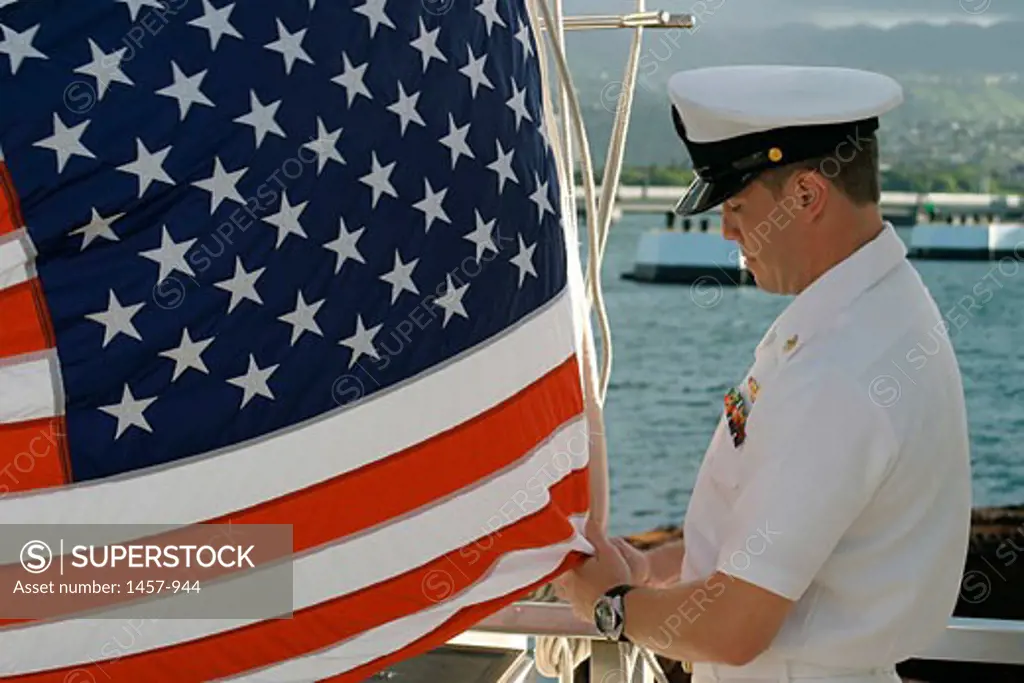 Aircrew Survival Equipmentman raising an American flag, USS Arizona Memorial, Pearl Harbor, Oahu, Honolulu, Hawaii, USA