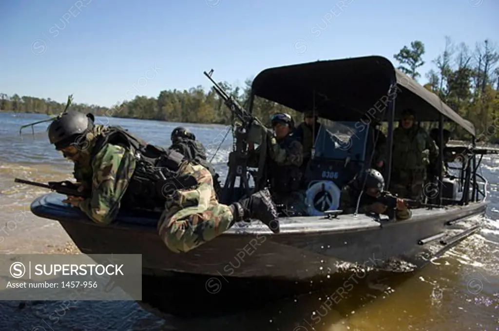 Sailor on a boat in a military training exercise, Naval Small Craft Instruction and Technical Training School, John C. Stennis Space Center, Mississippi, USA