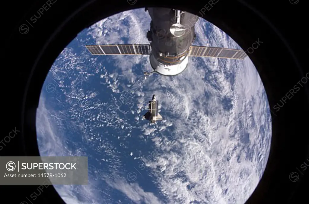Space Shuttle Discovery with earth in the background, photographed by an Expedition 16 crewmember after the shuttle undocked from the International Space Station