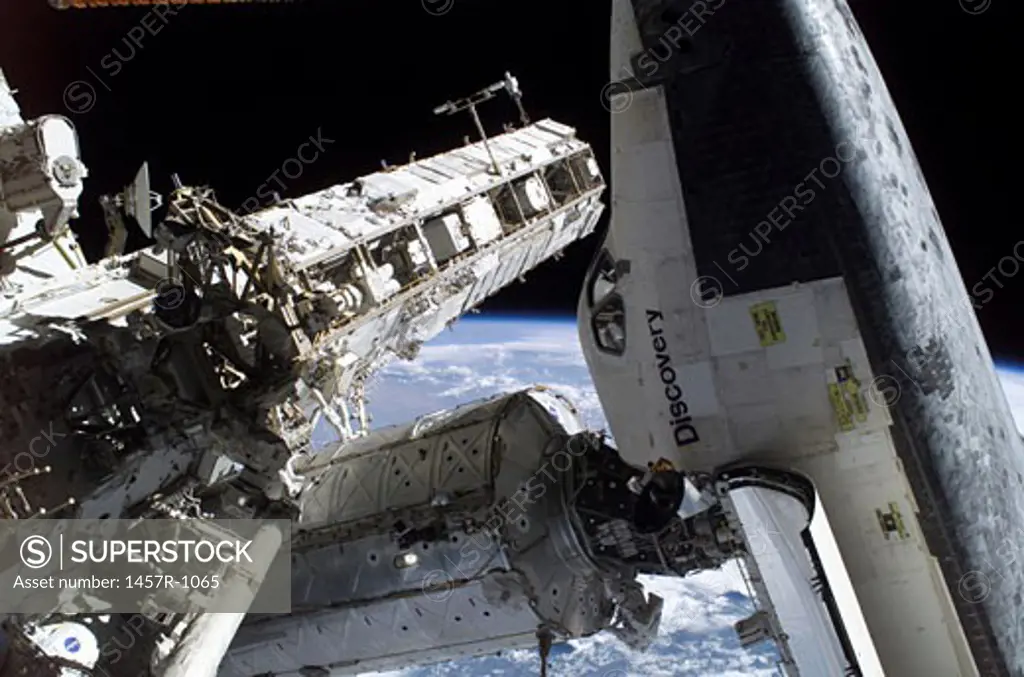 Space Shuttle Discovery docked to the Pressurized Mating Adapter 2 on the Destiny laboratory of the international Space Station