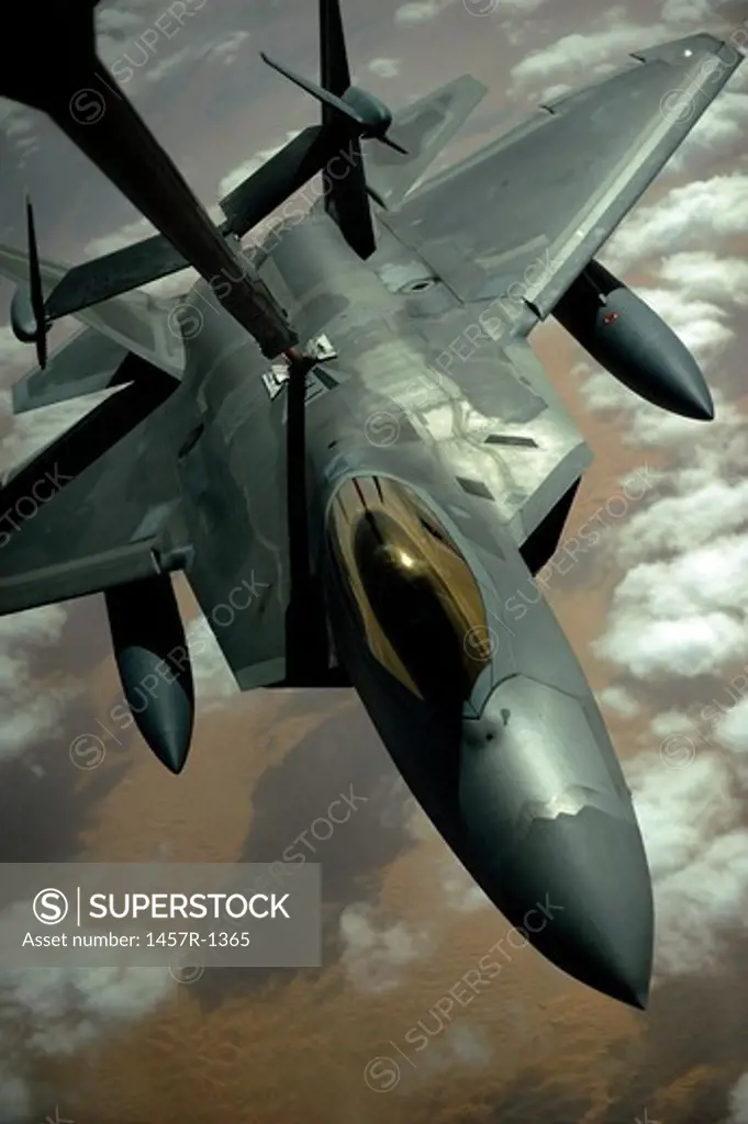 A U.S. Air Force F-22 Raptor is refueled by a KC-10A Extender aircraft over southwest Asia.