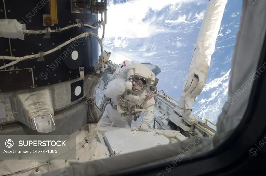 An astronaut participates in the a session of extravehicular activity.