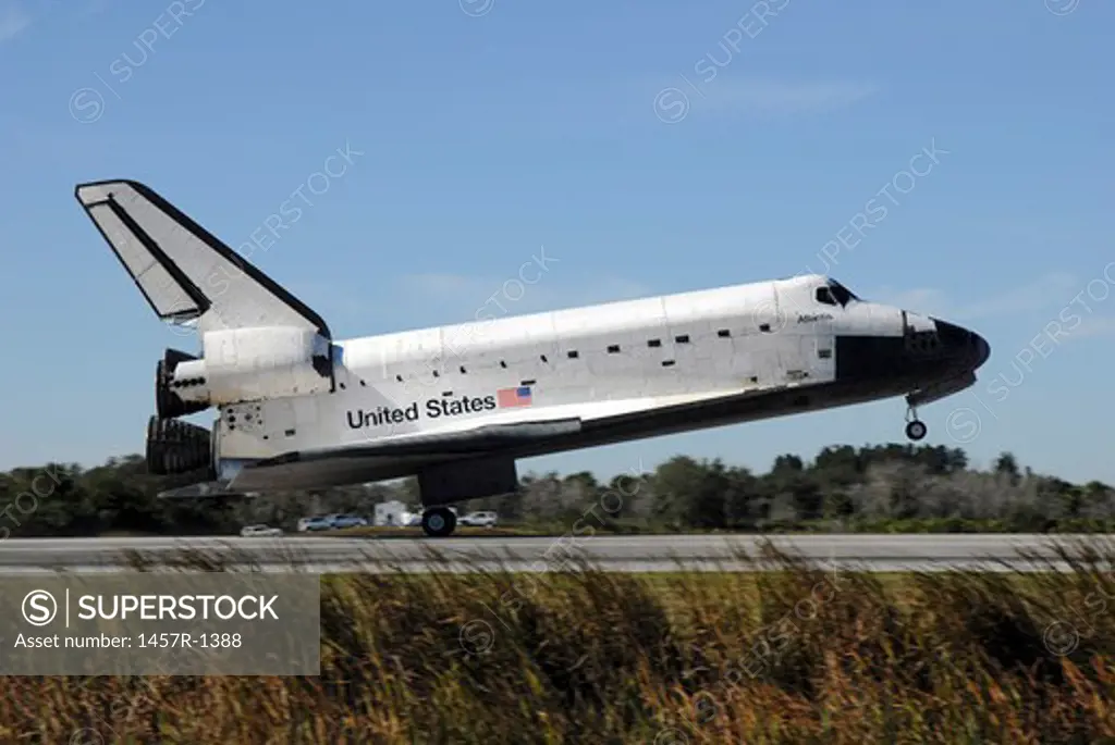 Space shuttle Atlantis touches down at Kennedy Space Center, Florida.