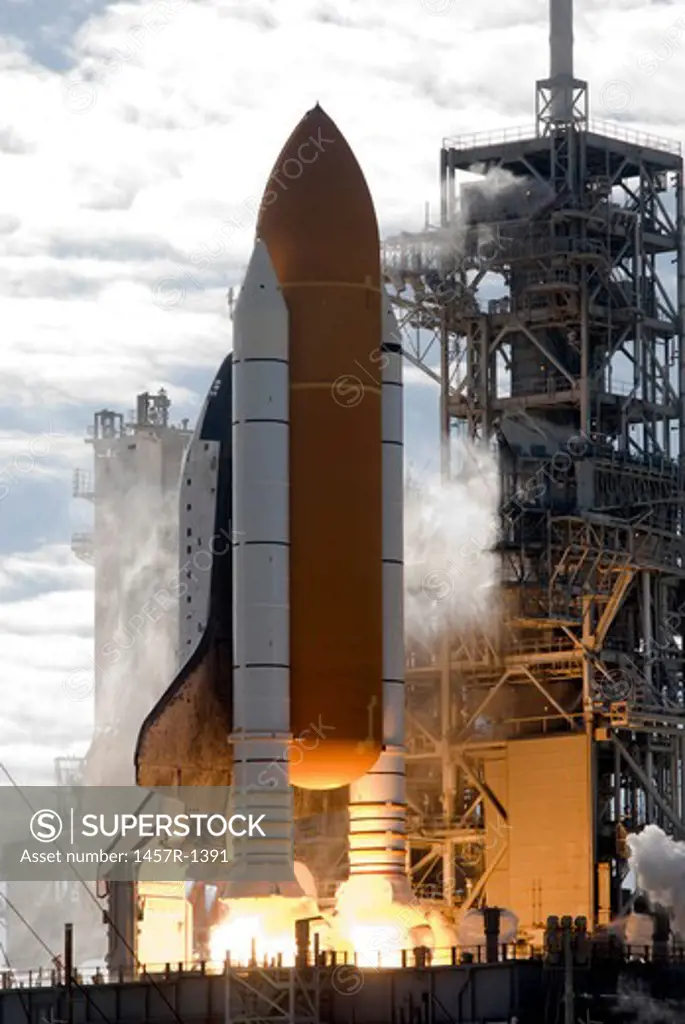 Space Shuttle Atlantis lifts off from its launch pad at Kennedy Space Center, Florida.