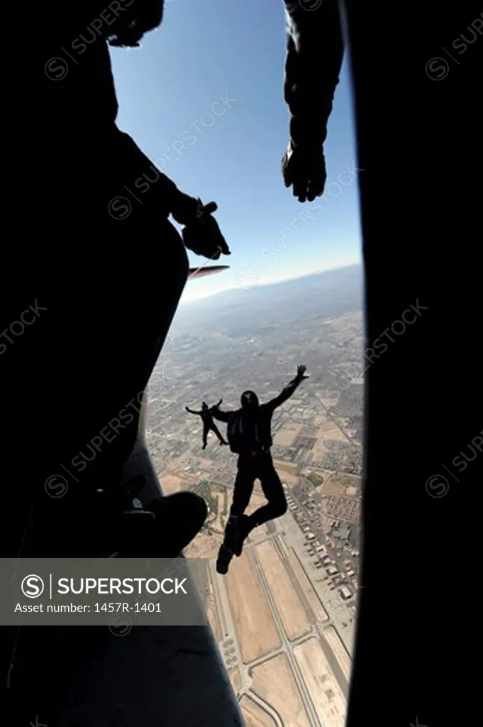 U.S. Air Force Academy Parachute Team jumps out of an aircraft over Nellis Air Force Base, Nevada