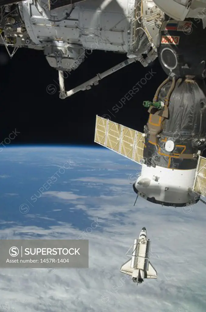 Space shuttle Endeavour, a Soyuz spacecraft, and the International Space Station.