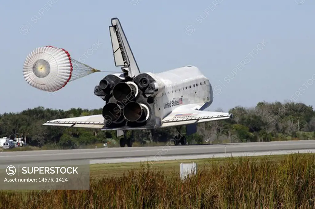 Space shuttle Atlantis unfurls its drag chute upon landing at Kennedy Space Center, Florida.