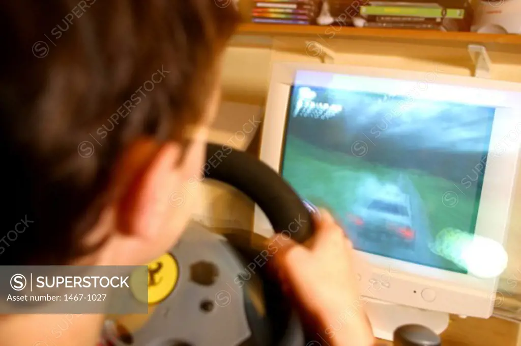 Close-up of a boy playing a video game