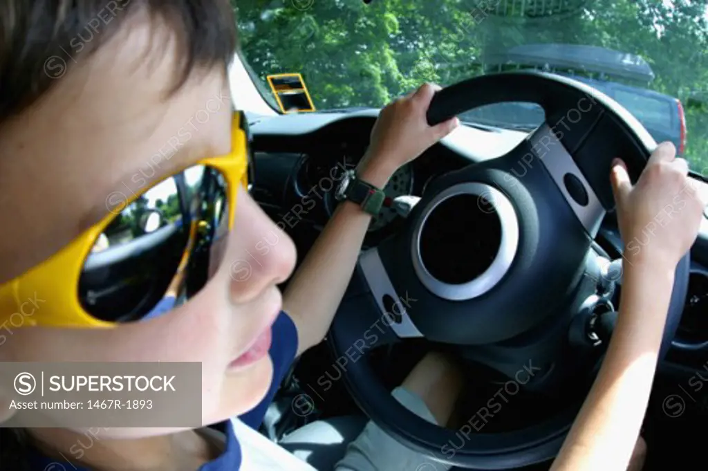 Close-up of a boy sitting in a car